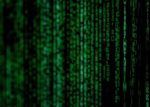 Picture of lines of computer code in the style of the matrix. Picture represents Elorn's blog post on data security.